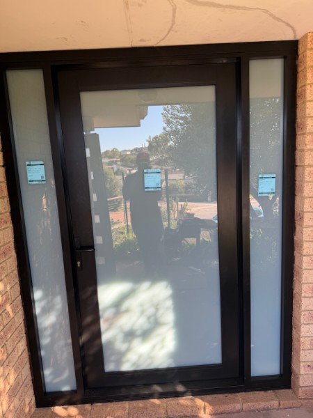 Dark aluminium framed glass entry door