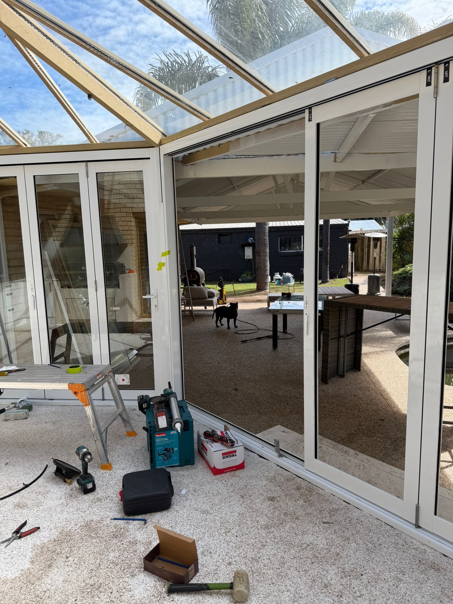 Patio glass enclosure during installation
